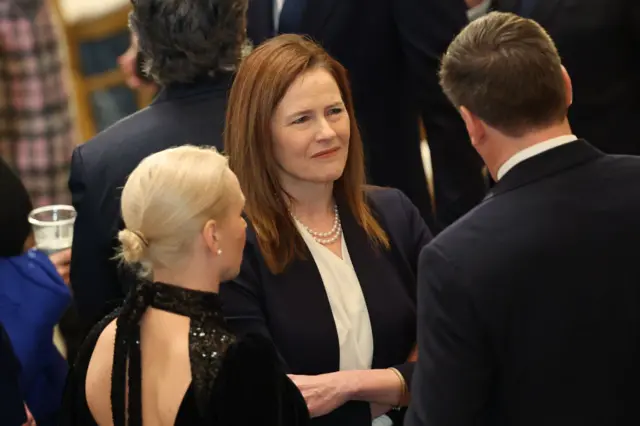 Supreme Court Justice Amy Coney Barrett (centre)