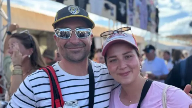 Bridie McCarthy and Jesse Masters pose together at at Glastonbury