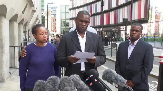 Daniel's family reads a statement from a piece of paper