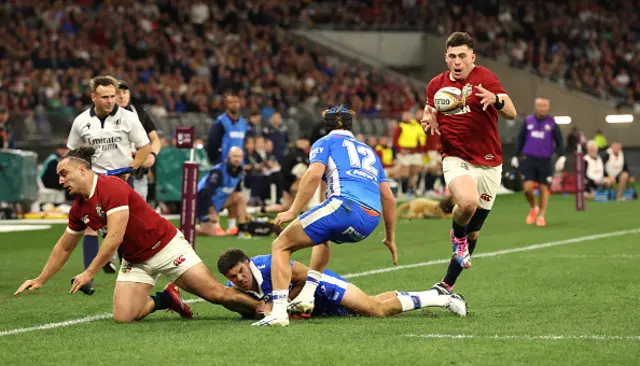 James Lowe is tackled as Dan Sheehan catches the ball