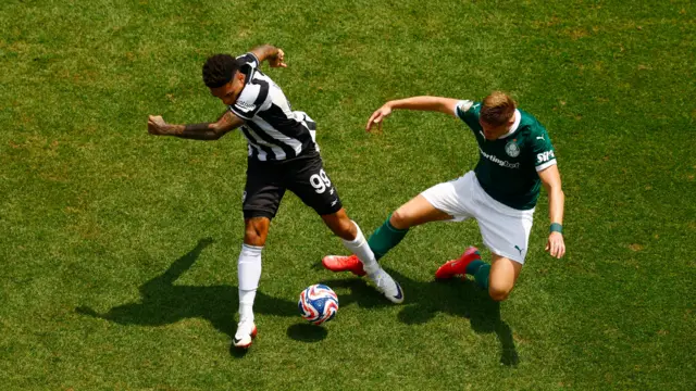 Jesus and Fuchs battle for the ball