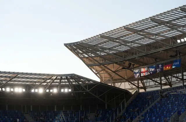 Roof of stadium as the sun beams in