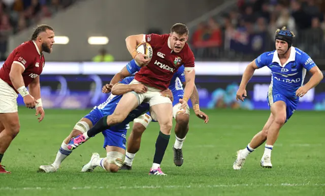 Garry Ringrose of the British & Irish Lions is held by Nick Champion de Crespigny