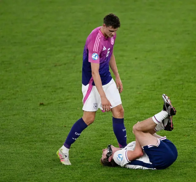 Scott lies stricken after being crunched with a bad tackle