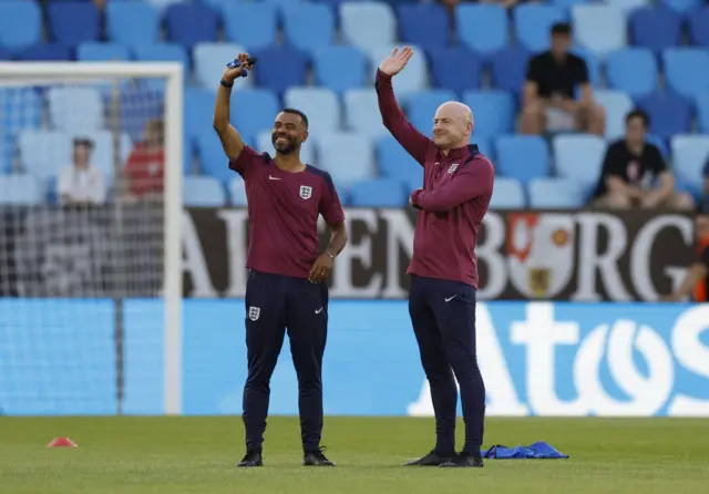 Cole and Carsley wave at someone in the stands