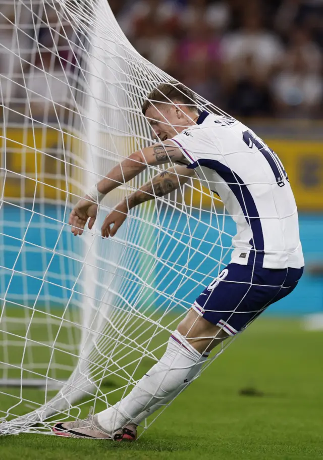 Stansfield falls into the net after missing a cross by inches