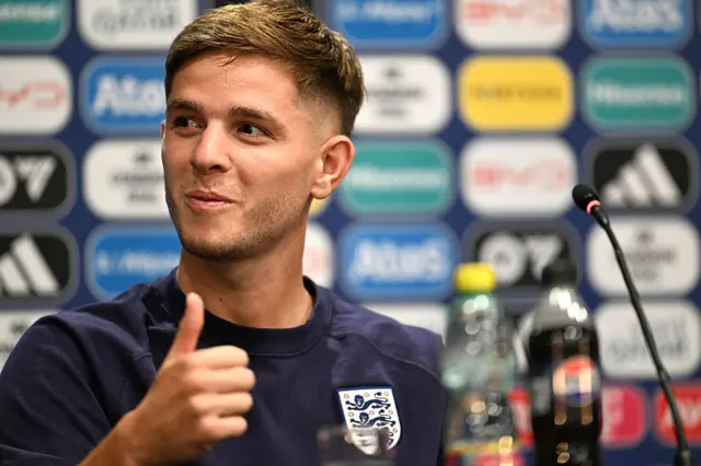 James McAtee gives a thumbs up during the press conference