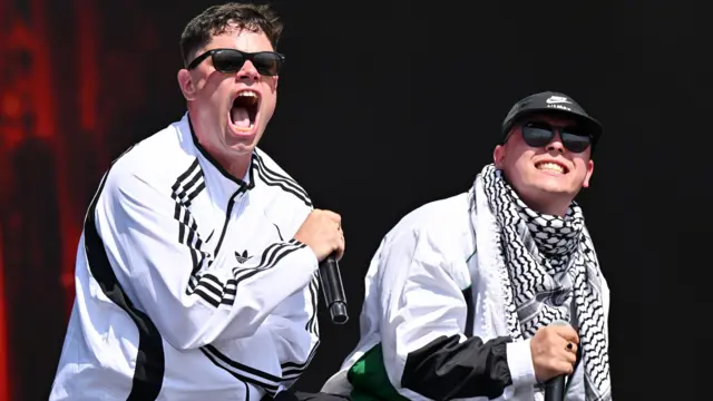 Móglaí Bap and Mo Chara performing as they open their set. They are wearing black and white and sunglasses