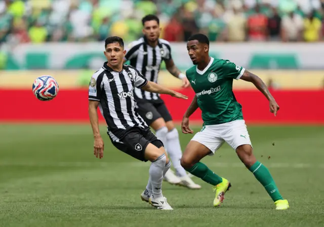 Andrade and Savarino duel for the ball