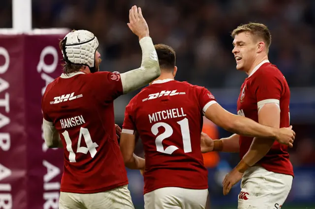 Garry Ringrose of the British Lions high fives Mack Hansen