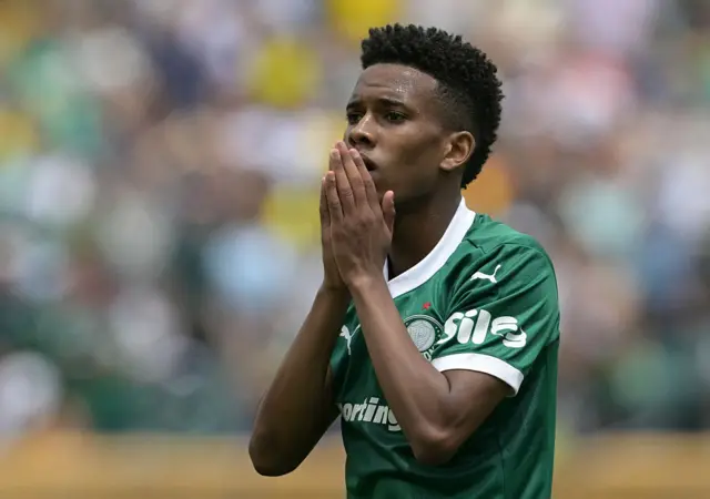 Estevao reacts to his shot being saved by putting his hands to his mouth