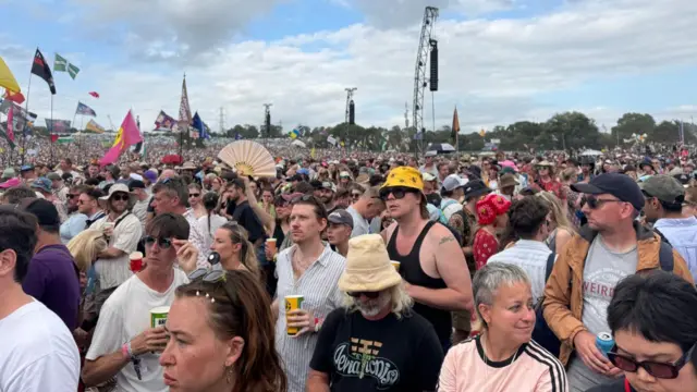 a crowd fills in at glastonbury