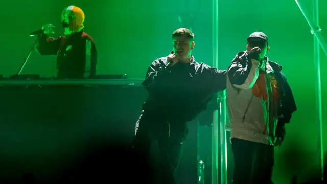 Irish rap group Kneecap perform on stage