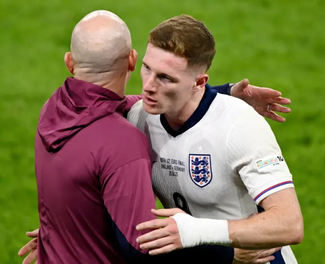 Anderson and Carsley embrace as the Forest man is subbed