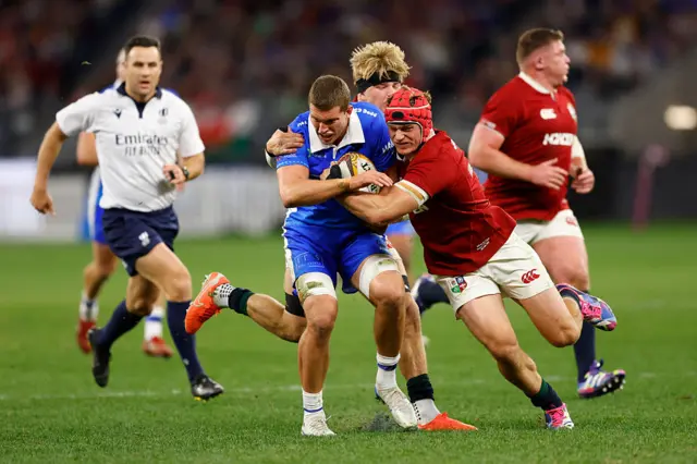 Josh van der Flier makes a tackle