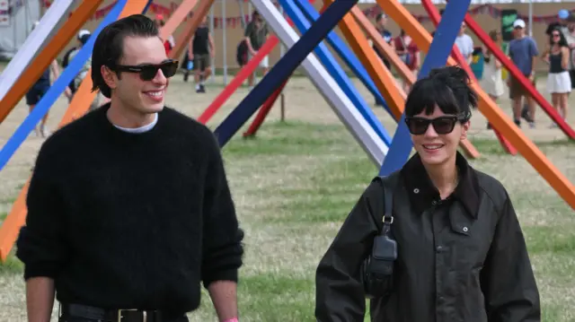 Marco Capaldo and Lily Allen are seen on day two of the Glastonbury Festival 2025 wearing iconic British heritage brand Barbour