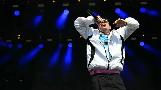 Moglai Bap of Irish rap band Kneecap perform at the West Holts stage.