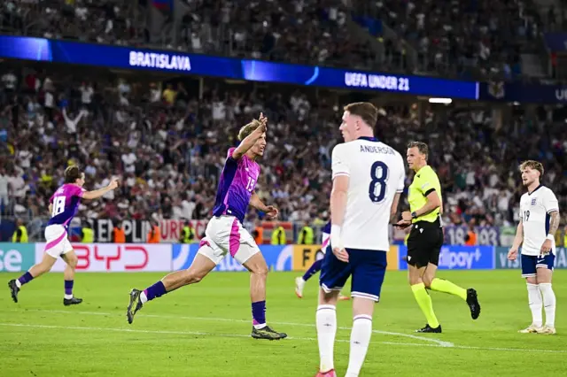 England players stand frustrated after conceding in stoppage time