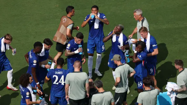 Chelsea players enjoy a drinks break during their game against Benfica