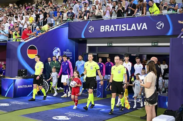 The teams walk out of the tunnel pre kick off