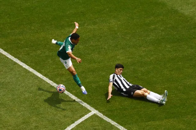 Roque's shot is blocked just inside the box