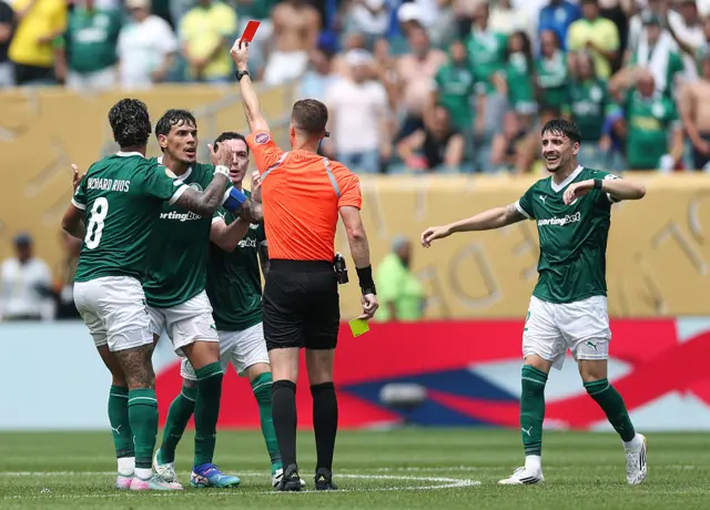 Referee shows Gomez a red card