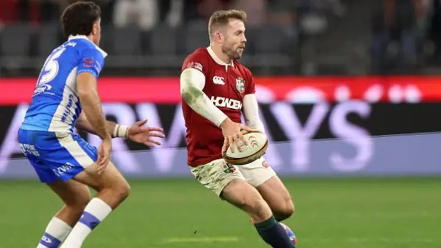 Elliot Daly of the British Irish Lions passes the ball
