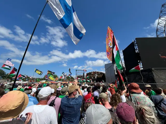 Thousands gather in front of the West Holts stage