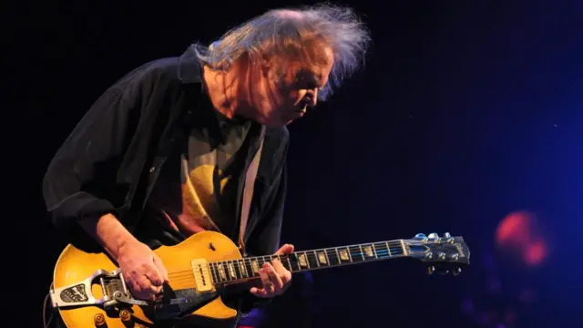 Neil Young performs on the Pyramid Stage at the Glastonbury Festival 2009.