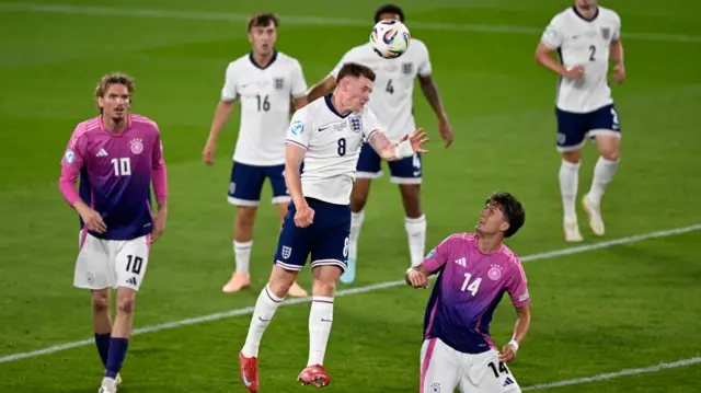Anderson heads the ball clear