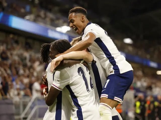 England celebrate Rowe's goal in the corner