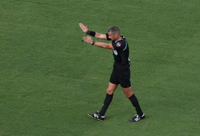 The referee signals that to the players to go off the field