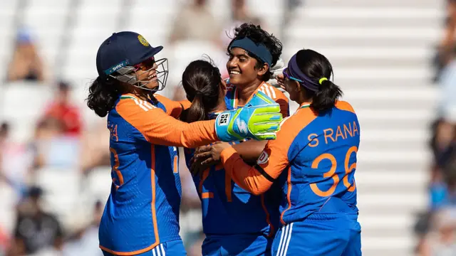 Shree Charani of India (2nd right) celebrates with her team mates after taking the wicket of Alice Capsey of England during the 1st Women's Vitality IT20 match between England and India