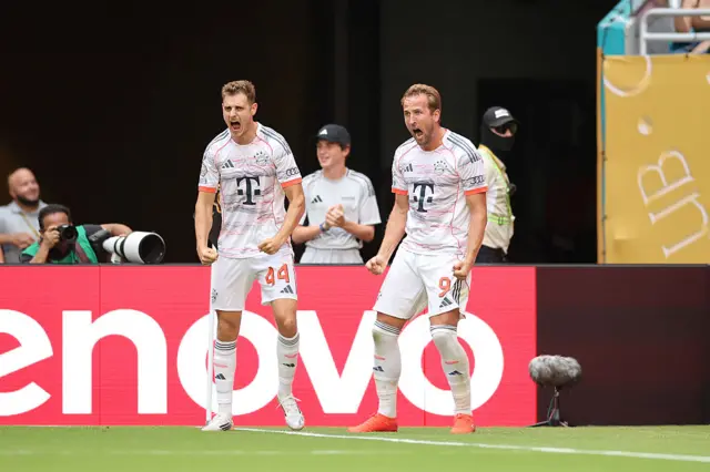 Harry Kane celebrates after scoring his second and Bayern Munich's fourth.