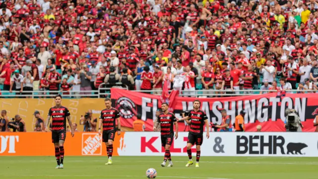 Flamengo players react after conceding their second goal of the game