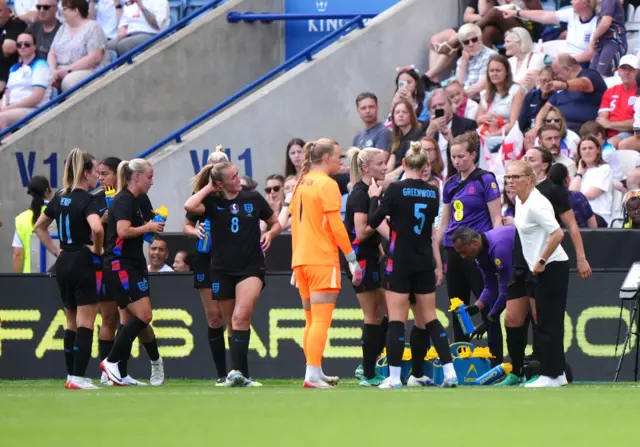 England head coach Sarina Wiegman addresses players at a drinks break