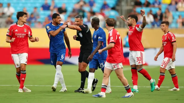 The referee points to the penalty spot
