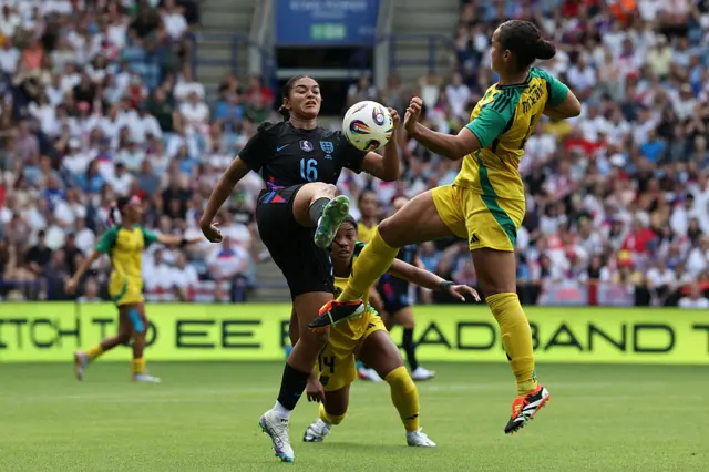 England's defender #16 Jess Carter (L) vies with Jamaica's Kayla McKenna (R) during the Women's International friendly football match between England and Jamaica at King Power Stadium in Leicester, central England on June 29, 2025.