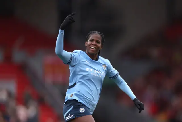 Khadija Shaw of Manchester City celebrates scoring her team's first goal during the Barclays Women's Super League match between Liverpool and Manchester City at Anfield on October 13, 2024 in Liverpool, England.
