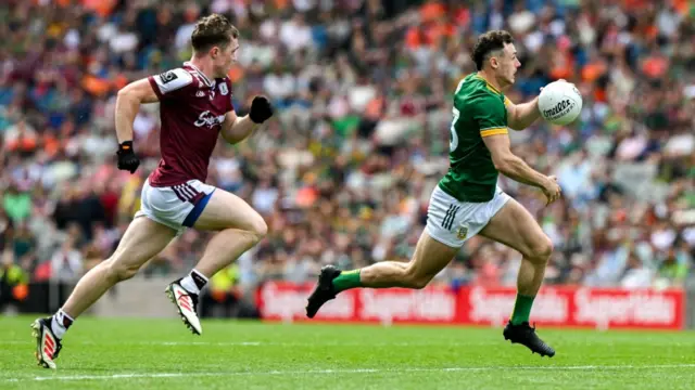 Meath's Jordan Morris races past Jack Glynn