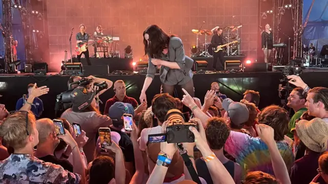 St Vincent shakes hands and greets fans in the crowd at Woodsies stage