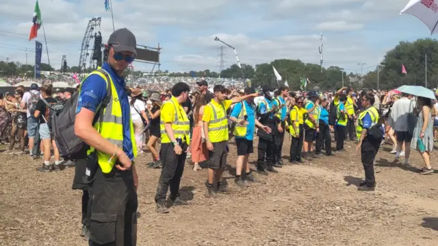 Stewards next to the Pyramid Stage