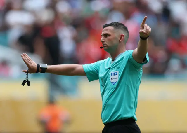 Michael Oliver waves away penalty appeals
