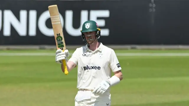 Adam Hose raises his bat