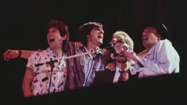 Rod Stewart (far right) performs live on stage with, from left, Ian McLagan, Ronnie Wood, Kenney Jones and Ronnie Lane