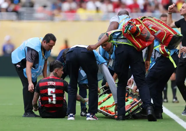 Erick Pulgar awaits a stretcher after being injured