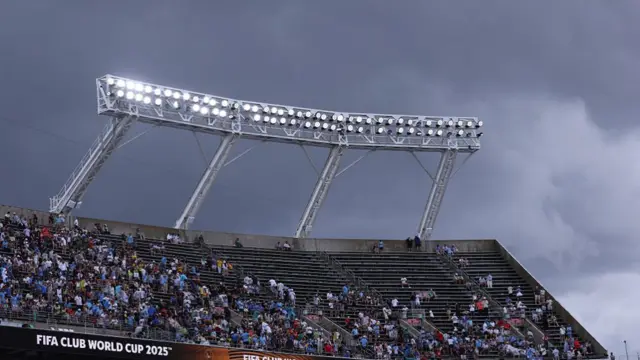 A general view of Camping World Stadium as storm clouds gather overhead