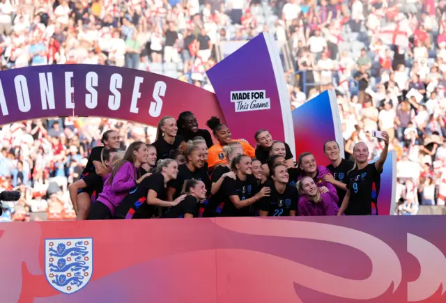 England players celebrate following a women's international friendly match at the King Power Stadium, Leicester