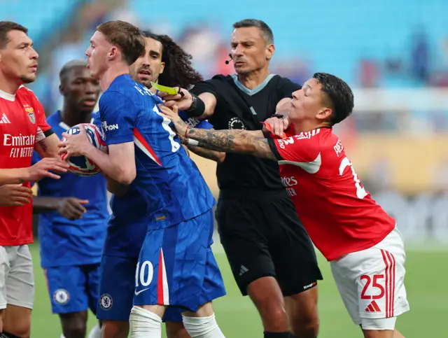 Chelsea's Cole Palmer and Benfica's Gianluca Prestianni react with referee Slavko Vincic