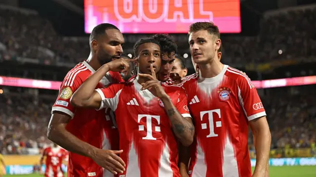 Bayern Munich midfielder Michael Olise celebrates scoring
